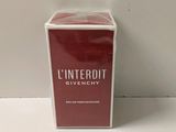 an image of a box of perfume sitting on top of a table