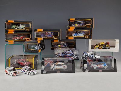 a lot of toy cars that are in a display case