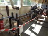 a machine that is sitting in a room with a red and white tape around it