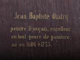 a plaque on the side of a building that says jean baptiste oury