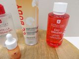 three different types of skin care products sitting on a table