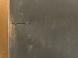 a crack in the side of a refrigerator door