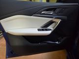 the interior of a car with the door open and the door handle open