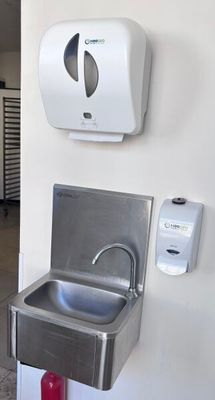 an image of a stainless steel sink in a public restroom