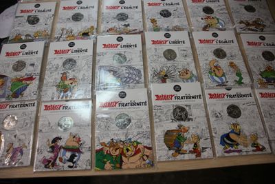 a lot of comics on the table together