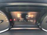 a close up of a car ' s dashboard with a digital clock