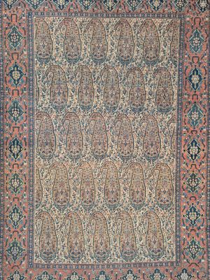 an antique persian rug with a floral design