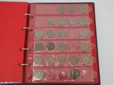 a red binder with a bunch of coins inside of it