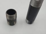 two black pipes sitting next to each other on a table