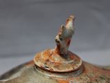 a close up of a teapot on a table