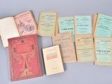 many old books that are sitting on top of a table