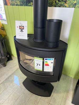 a wood burning stove in the corner of a room