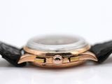 an image of a close up of a watch on a white surface