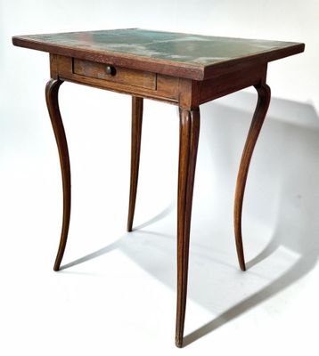 a small wooden table with a marble top on a white background