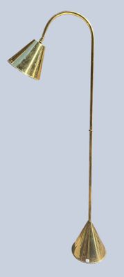 a close up of a lamp on a stand with a blue background