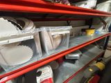 many bins of food on the shelves in the store