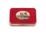 a small red box with a picture of a castle on it