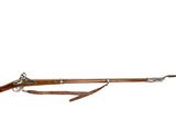 an old rifle with a long wooden handle and a long wooden handle