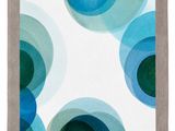 a white and blue rug with circles on it