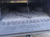 an image of a truck with the back of it ' s bed open