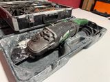 two tools in a case sitting on a table
