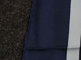 a close up of a tie with a blue and white stripe on it