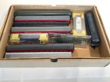 a box with a bunch of different types of pens and pencils