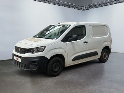 the white van is parked in a large room with white walls