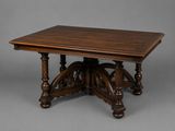 an old wooden table with a wooden top on a grey background