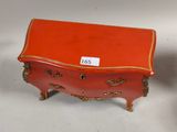 pair of orange and gold painted chests with gold trims