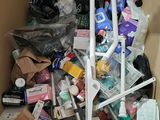 a cardboard box filled with many different types of toothbrushes and toothpaste