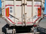 a picture of a dump truck parked in a parking lot