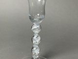 a glass that has a spiral design on it