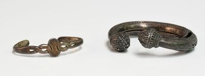 pair of silver rings and a ring with a snake on it