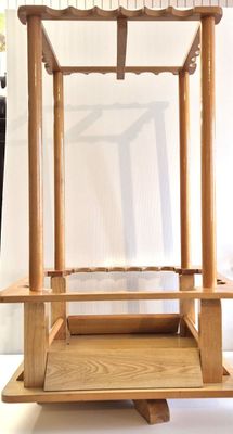 a wooden stand with a white cloth on it