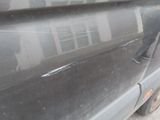 a close up of a car with a broken door handle