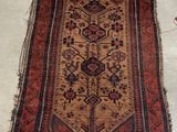 an old rug is laying on the floor next to a pair of scissors