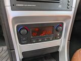 a radio in the center of a car with a clock on it