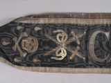 a black and gold banner with a skull and crossbones on it