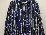 a blue and white shirt hanging on a hanger