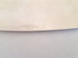 a knife that is laying on top of a table