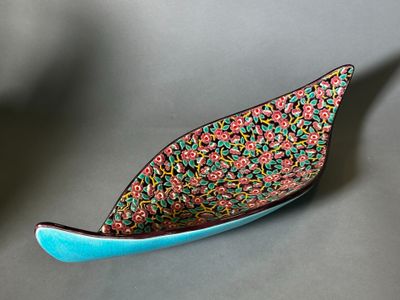 a small blue bowl that has sprinkled sprinkles on it