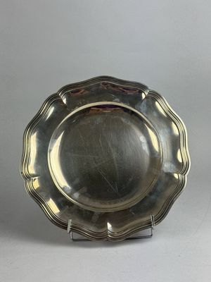 silver plate on stand on grey background with white background