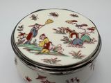 a white box with a design of birds and flowers on it