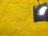 a close up of a yellow jacket with a tag on it