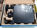 a box with a computer inside of it on a table