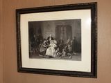 un tableau accroché au mur au-dessus des toilettes