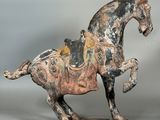 statue of a horse with a saddle on it ' s back