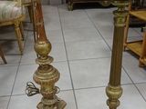 two candles that are sitting on the floor next to each other