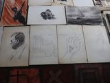 a lot of drawings on the floor of this room